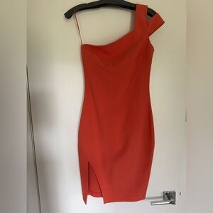 Likely coral/orange mini one shoulder dress